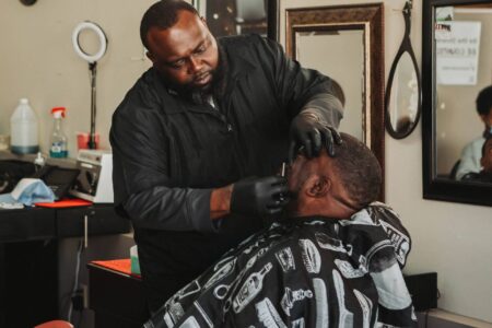 barber shaves a client
