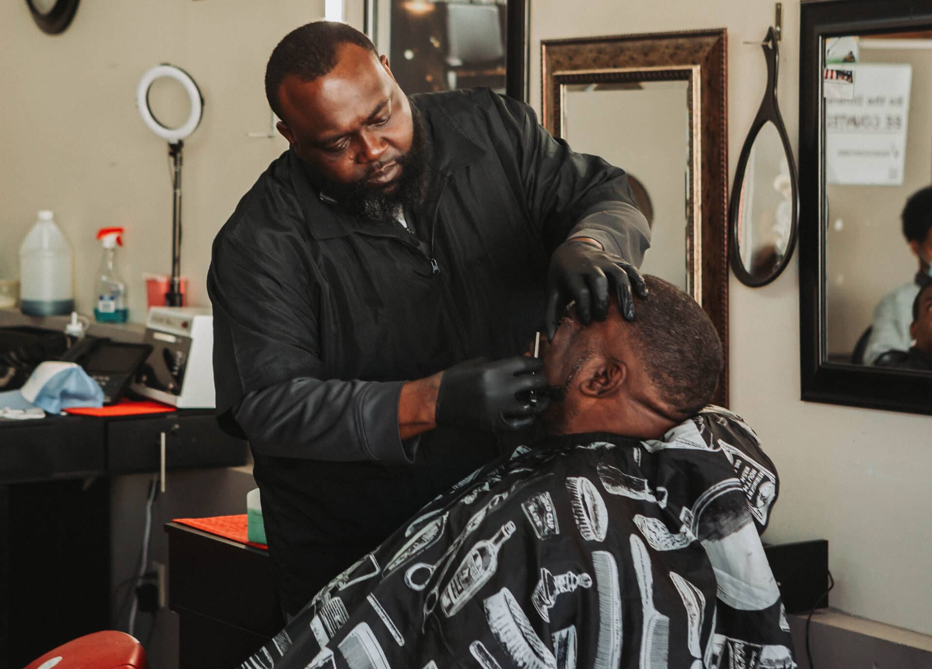 barber shaves a client